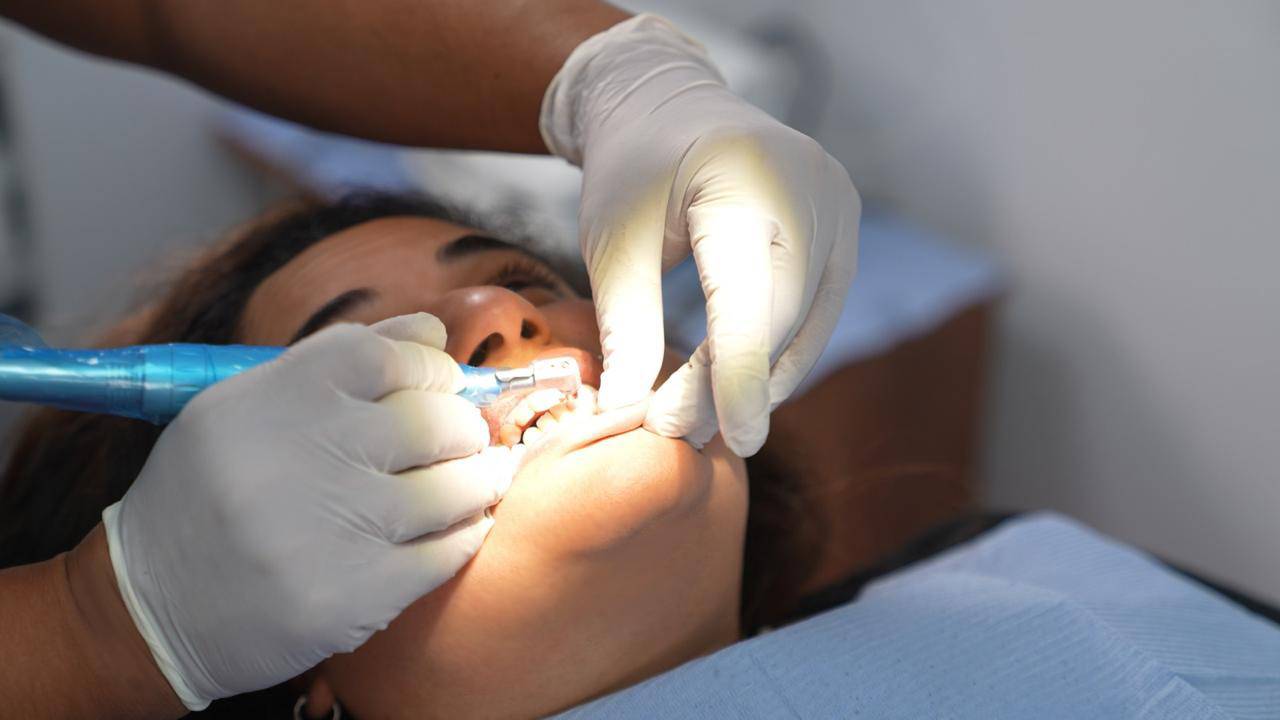 elite-smile-clinics-new-cairo-12 Patient receiving dental treatment in operating room at Elite Smile Clinics New Cairo